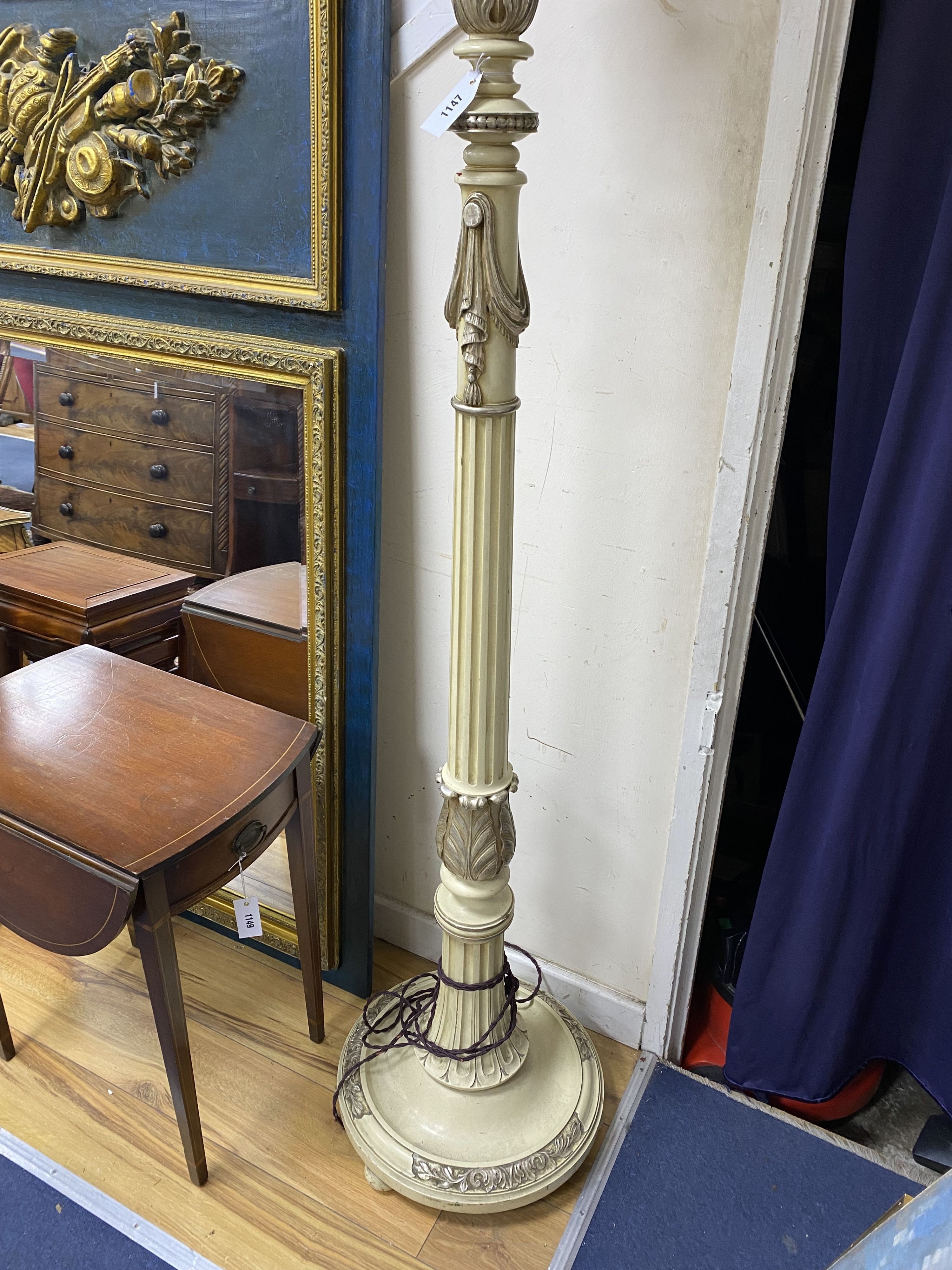 A cream painted part silvered uplighter floor lamp, height 190cm